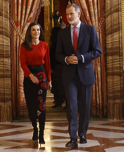 Queen Letizia Embraces Autumn Hues in Brick Red .